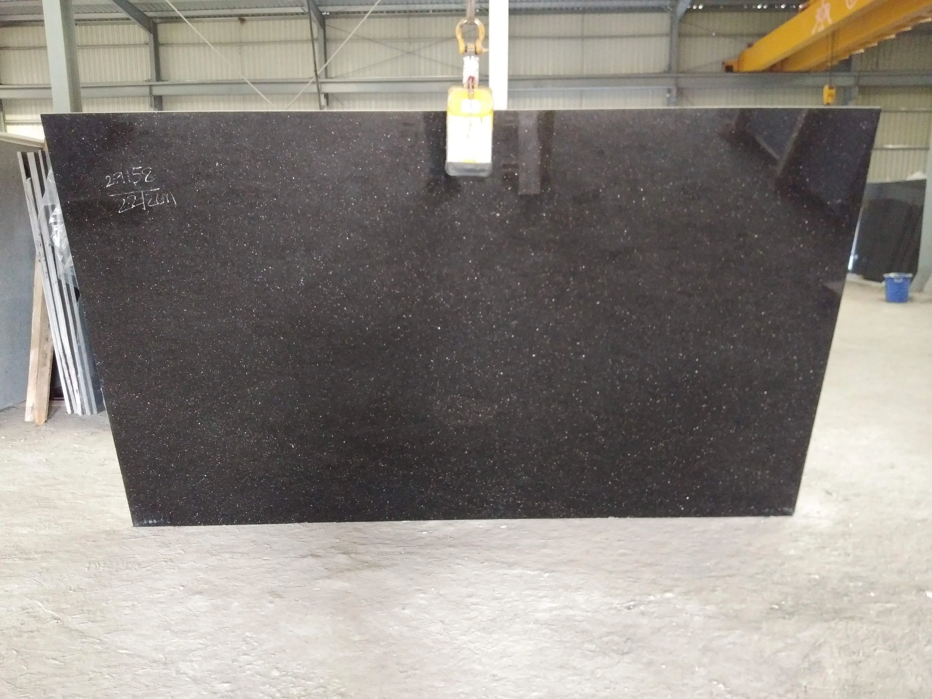 Close-up of a dark granite slab with golden flecks